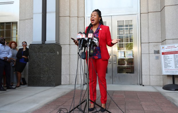 Monique Worrell speaks during a press conference, Wednesday, Aug. 9, 2023, outside her former office in the Orange County Courthouse complex in Orlando, Fla. Florida Gov. Ron DeSantis suspended Worrell on Wednesday, again wielding his executive power over local government in taking on a contentious issue in the 2024 presidential race. Worrell vowed to seek reelection next year and said her removal was political and not about her performance. (Ricardo Ramirez Buxeda/Orlando Sentinel via AP)