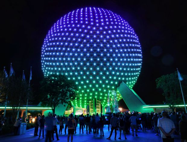 Spaceship Earth at Epcot displays an all-new, first-of-its-kind programmable LED lighting system, Wednesday night, September 29, 2021, at a sneak preview ahead of its official October 1 debut at the theme park at Walt Disney World, in Lake Buena Vista, Fla. The new display is a part of the 'Beacons of Magic' being rolled out at all four Florida parks for the 50th anniversary of Walt Disney World. (Joe Burbank/Orlando Sentinel)