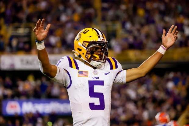 LSU quarterback Jayden Daniels (5) celebrates after one of his 5 touchdowns during the Tigers' 52-35 win against Florida Nov. 11 in Tiger Stadium. (AP Photo/Derick Hingle)