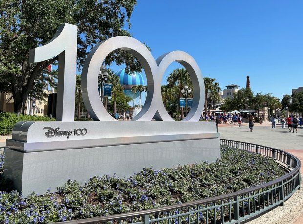 A Disney100 logo sign has been placed in the West End neighborhood of Disney Springs, part of the celebration of the 100th birthday of Walt Disney Co.
