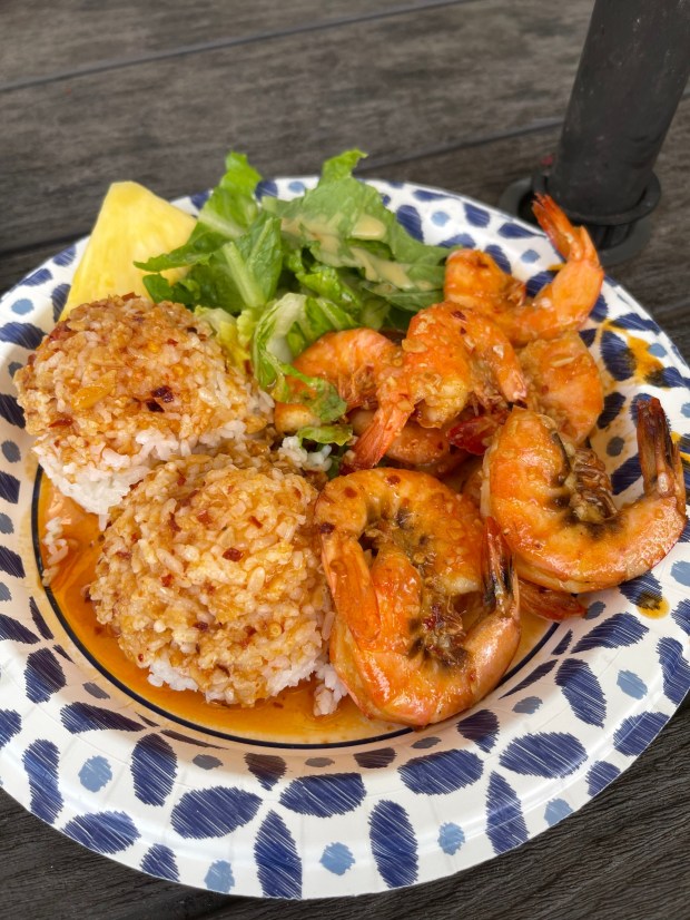 A plate of butter garlic shrimp over rice from Jenny's Shrimp Truck in Hale'iwa is just the ticket to refuel between Oahu adventures. (Ben Davidson Photography)