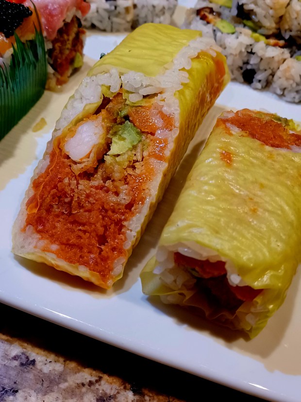 The sushi burrito roll has far less rice than you'd imagine, which is a good thing. It allows the flavors -- shrimp tempura, spicy tuna and spicy salmon among them -- to shine. Plus, it's pretty fun to eat. (Amy Drew Thompson/Orlando Sentinel)