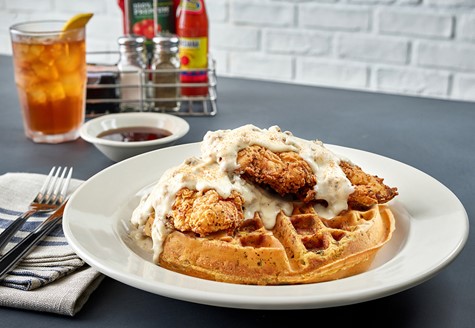 Stuff 'N Waffles, waffles pressed from cornbread stuffing, are back for a limited time at Metro Diner. Options include roasted turkey or savory ham with mashed potatoes & gravy and crispy chicken tenders & sausage gravy, pictured here. (Courtesy Metro Diner)
