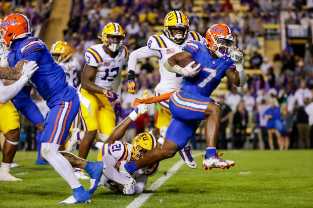 Florida running back Trevor Etienne (7) breaks a tackle by LSU safety Ryan Yaites (21) on a touchdown run during the Gators' 52-35 loss Nov. 11 in Baton Rouge. (AP Photo/Derick Hingle)