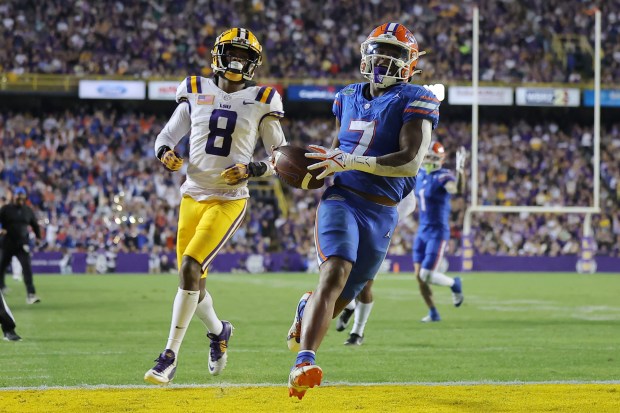 Florida tailback Trevor Etienne scored 3 touchdowns during his Louisiana homecoming as the Gators' fell 52-35 at LSU Nov. 11 in Baton Rouge. (Photo by Jonathan Bachman/Getty Images)